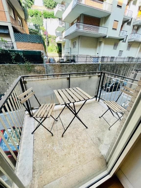 Private balcony with folding table and two chairs